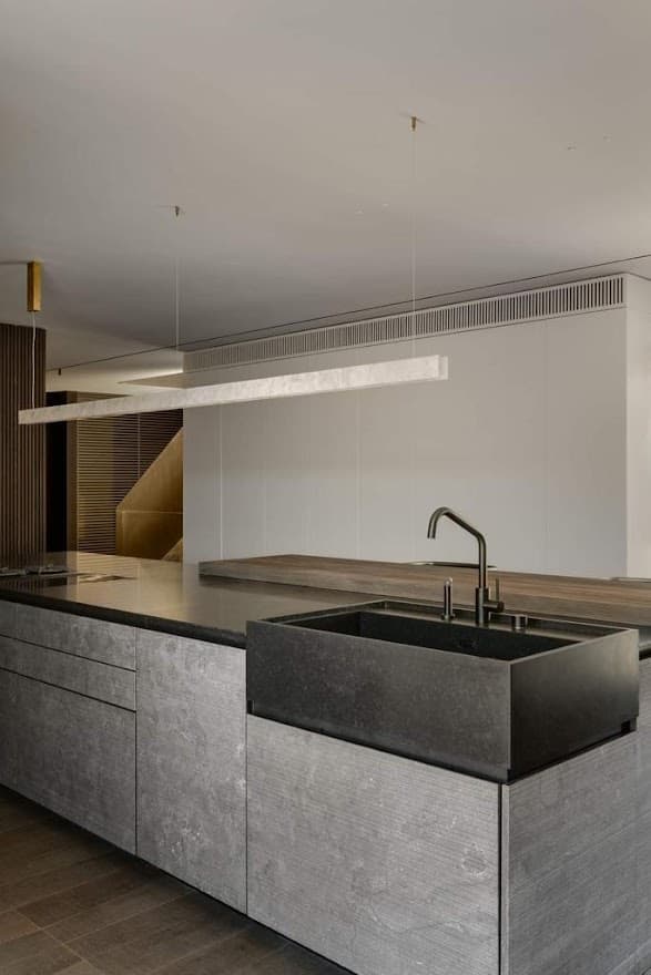 Kitchen island with an engineered quartz surface