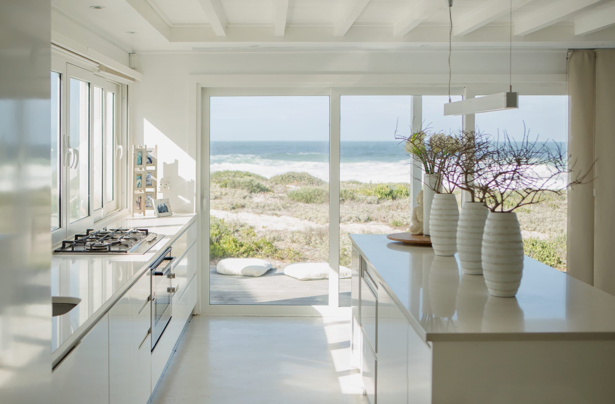 Bright kitchen concept with restrained coastal materials